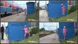Blonde Girl peeing at a train stop