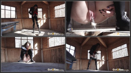 Brunette pees through a hole in wooden hut