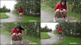 Dark haired exotic babe squatting to pee outside