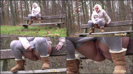 Pretty blonde squats on a wooden bench to piss