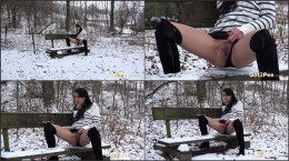 Pretty dark haired babe pisses outside in the snow