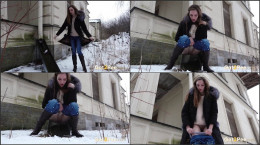 Stunning brunette pees while outside in the snow