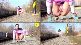 Valentina Ross squats to pee near the railway