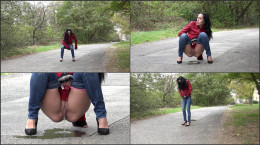 Raven haired European pees on a road