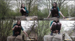 Raven haired hottie squats near railway to pee