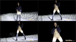 European babe in boots stands and pees in the snow