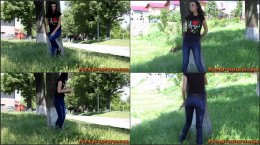 Peeing And Wetting Her Jeans Outdoor Near A House