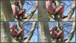 Claudia Macc sits in a tree to piss outside
