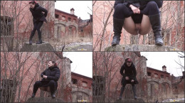Naughty European squats on a tree stump and pees