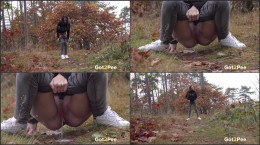 Mistika squats and pees over fallen leaves
