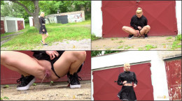Vanessa Hell squats by the garages to piss